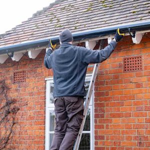 man-fixing-gutter